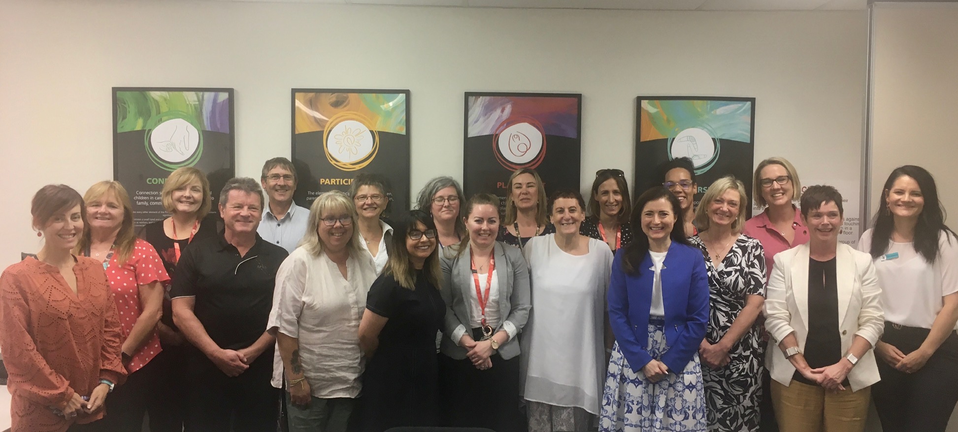 Minister for Child Protection standing with taskforce members.