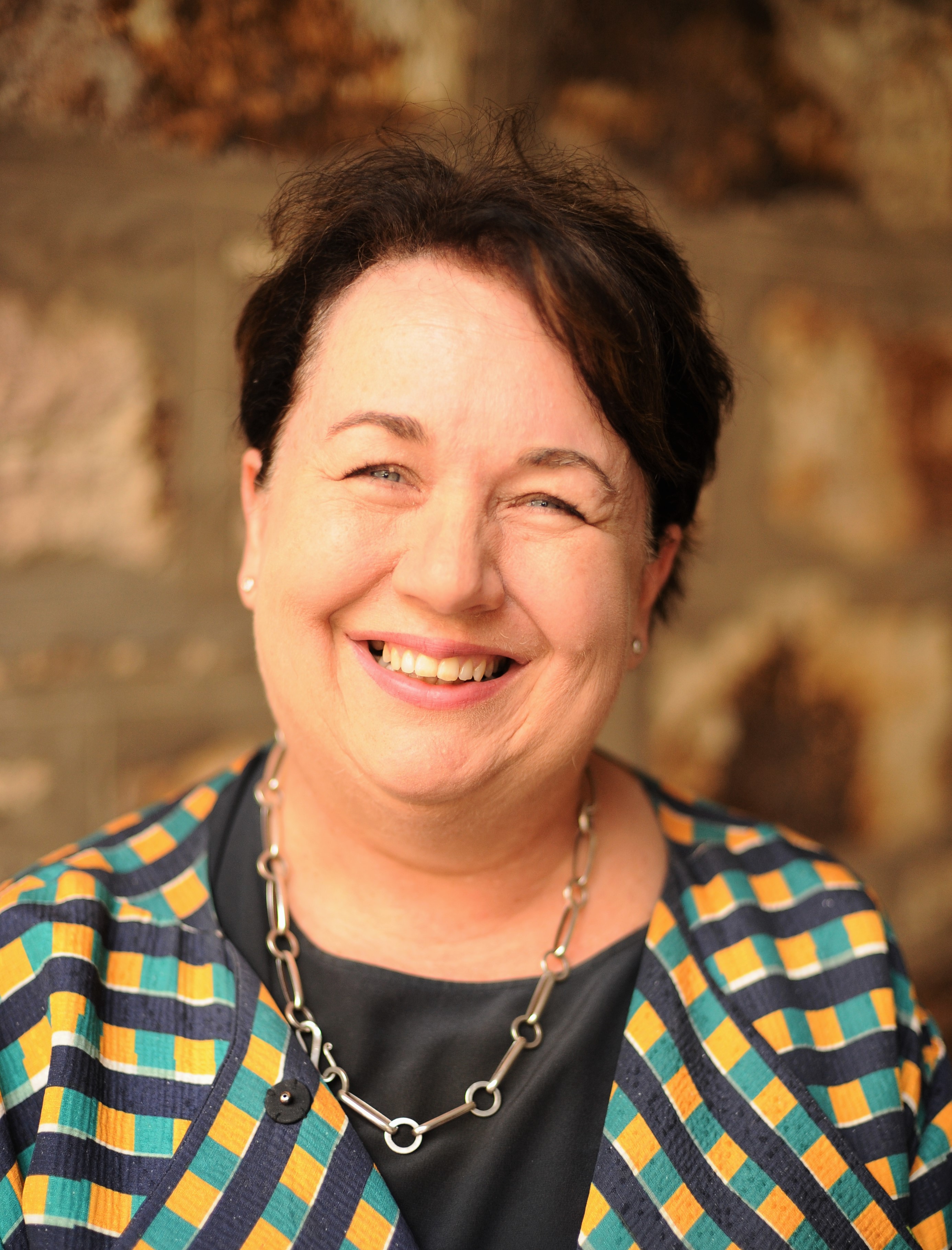 A head shot of Cathy Taylor, the Chief Executive of the department. Cathy is smiling at the camera