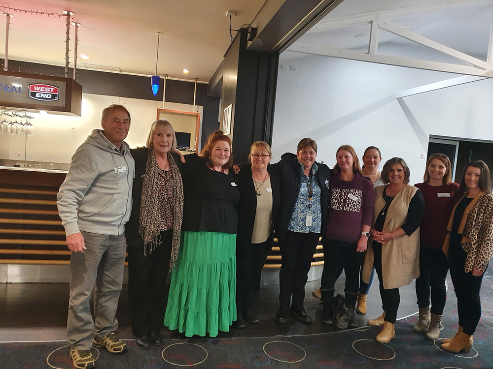 A photo of various people celebrating Foster and Kinship Carer Week 2022